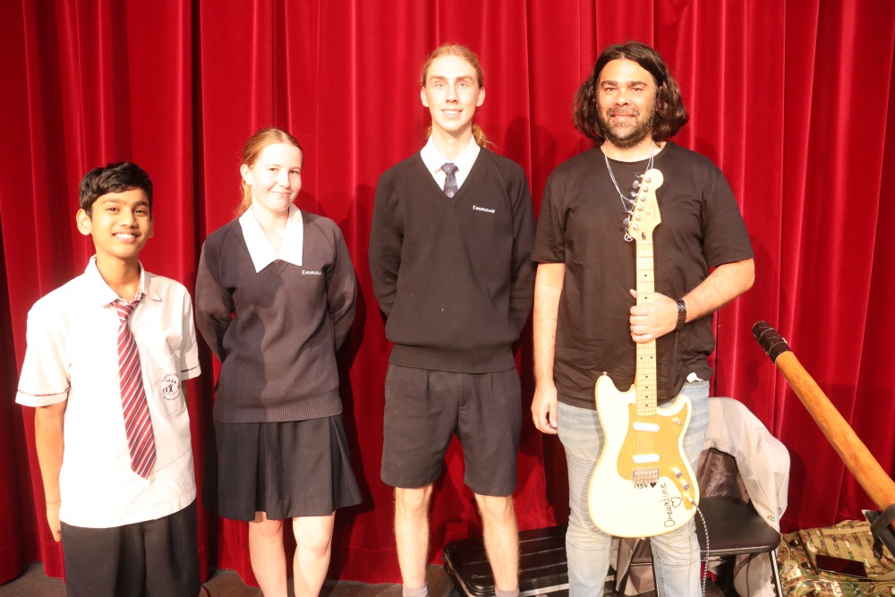 National Reconciliation Week activity - Emmaus College Students with indigenous musician Ben Barker